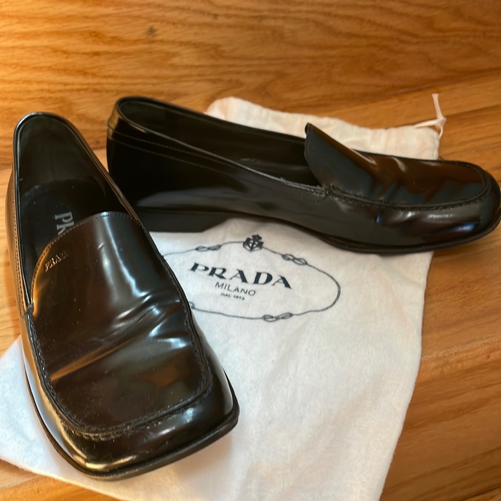 Authentic Prada black loafers with shoe dust covers